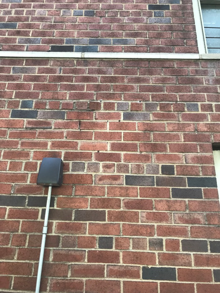 Fallout Shelter sign shadow on Manhattan Apartment building